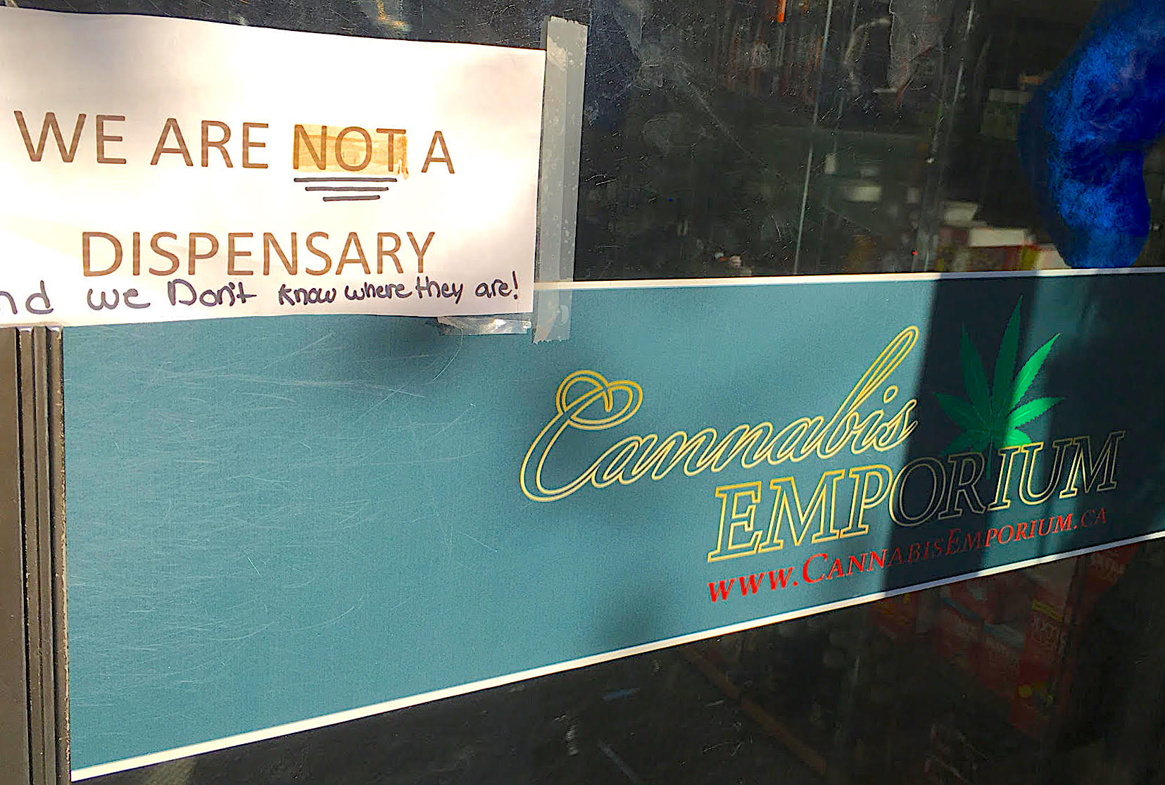  Sign outside Cannabis Emporium, a head shop across the street from Weeds. [Photo Amber-Dawn Davison]. 
