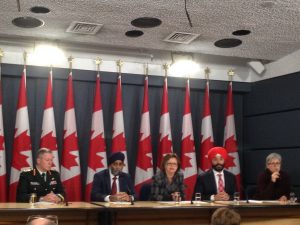 L-R: General Jonathan Vance; Defence Minister Harjit S. Sajjan; Public Services and Procurement Minister Judy Foote and Science and Economic Development Minister Navdeep Bains in this afternoon's press conference. (Photo: Floriane Bonneville)