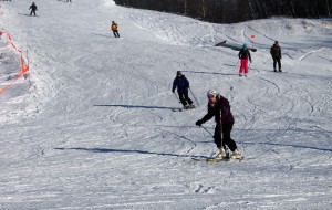 Skiers and snowboarders come down the mountain at Camp Fortune Friday afternoon (Roberta Bell, The Impact)