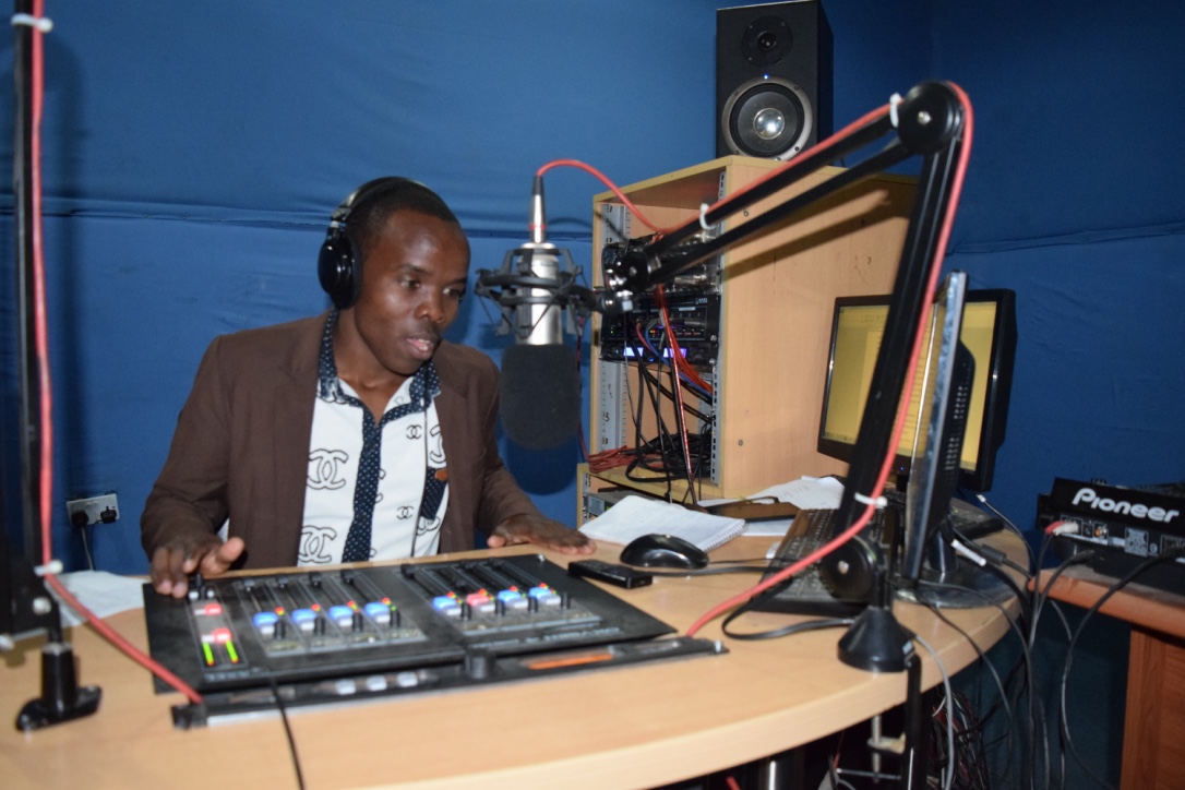 Christian Sumary records advertisements for his radio show.