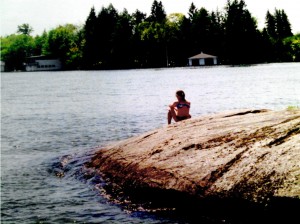 Myself as a child circa 1996, staring out onto Lake Joseph. 