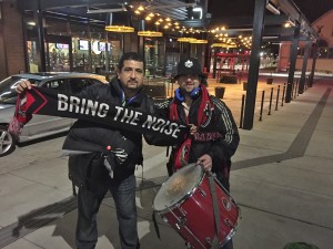 Photographer Martin Gonzales (left) and Bytown Boys SC founding member Stephane Brisson-Merrick (right) were ready to bring the noise before boarding the bus to New York. THE JUNCTION/Curtis Panke.