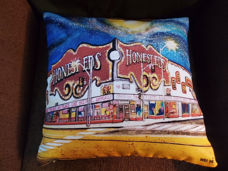 pillow with painting of Honest Ed's store