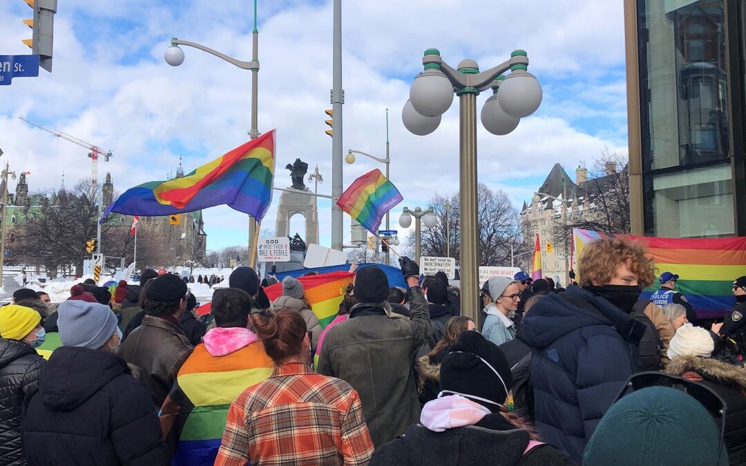 Counter protesters with rainbow flags and signs outnumber anti-drag show group
