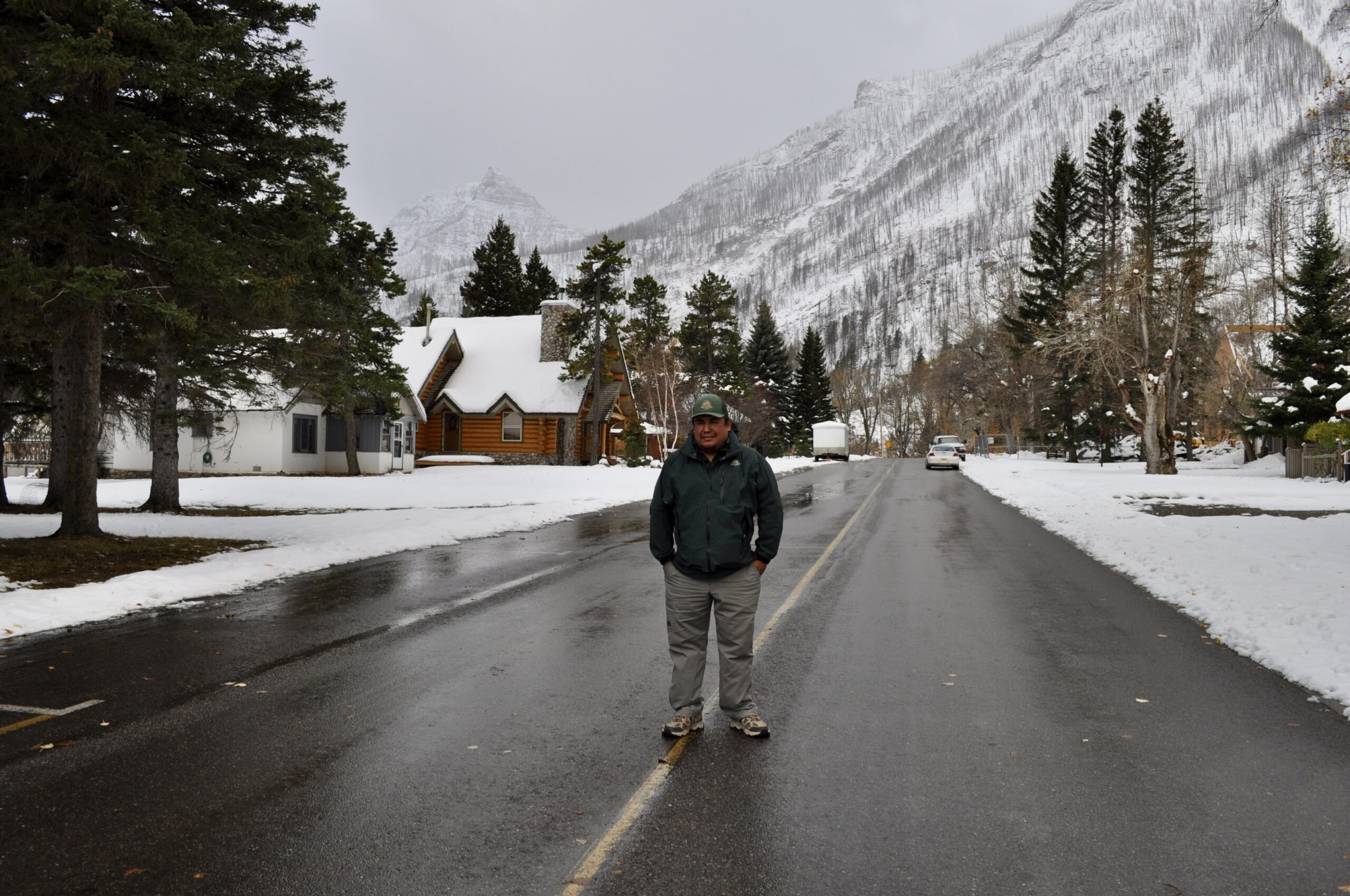 Kelly Tailfeathers stands in the road in Waterton’s townsite.