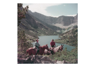 A man and woman ride on horseback on Bertha Trail in Waterton Lakes National Park in 1952.