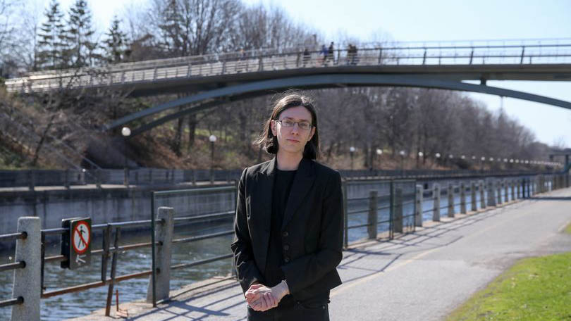 Lyra Evans stands in front of the canal