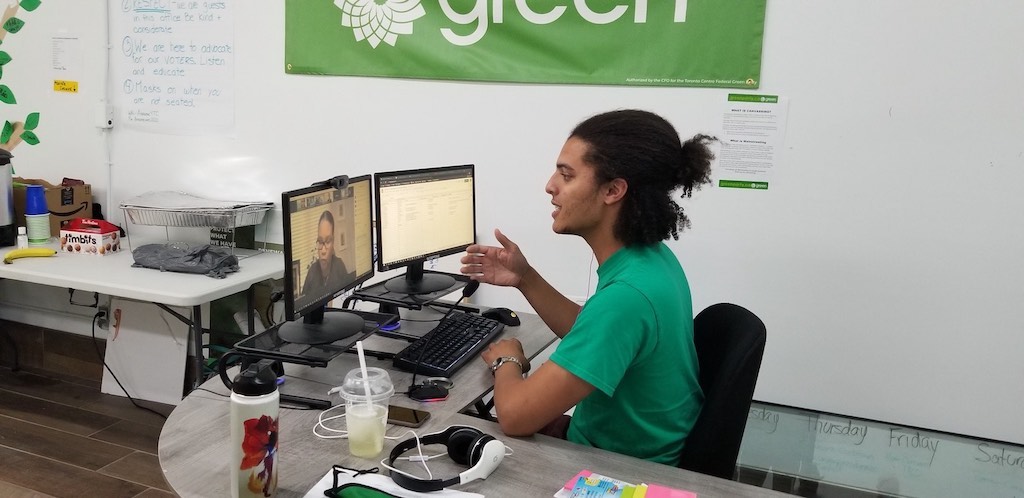 photo of Kayne Alleyne-Adams working at a desk