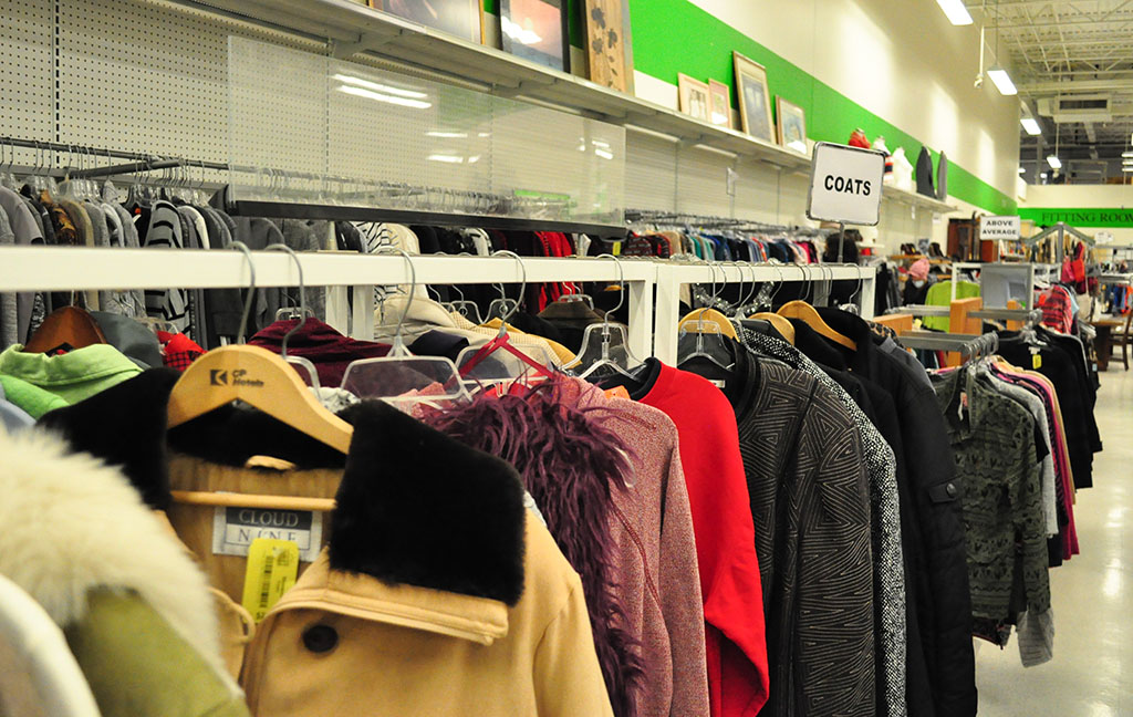 a rack of womens' clothes at mission thrift store